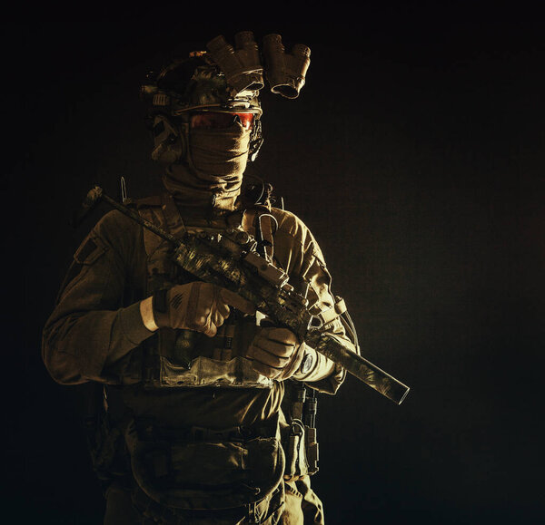 Portrait of elite commando fighter in darkness