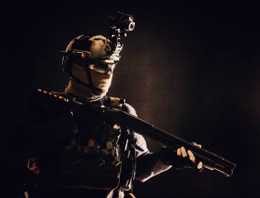 Army elite troops soldier low key studio portrait