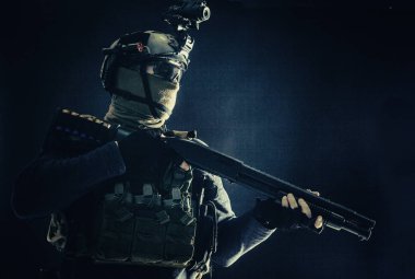 Army elite troops soldier low key studio portrait