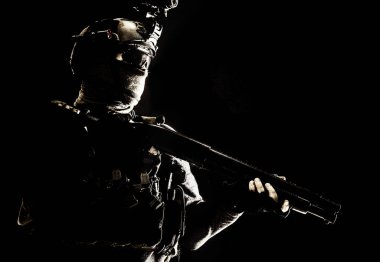 Army elite troops soldier low key studio portrait