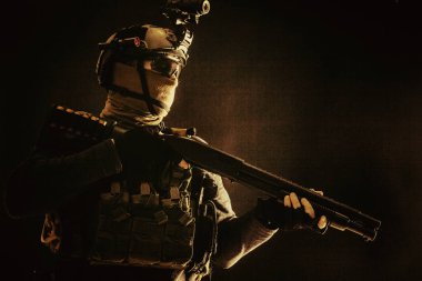 Army elite troops soldier low key studio portrait