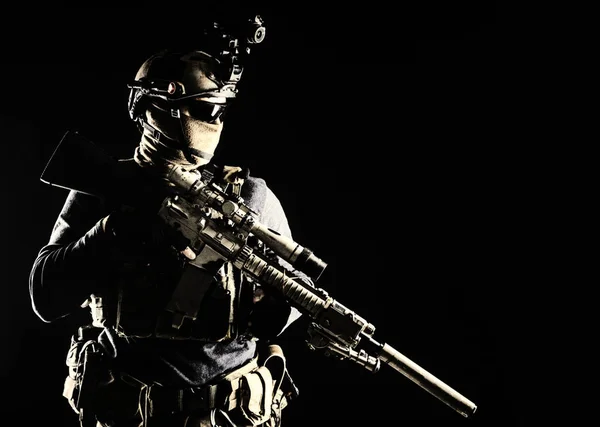 Army marksman with sniper rifle in darkness — Stok fotoğraf