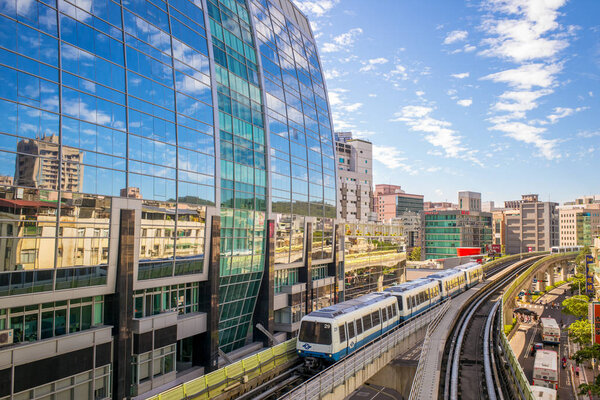 Taipei with metro train approaching Xihu Station