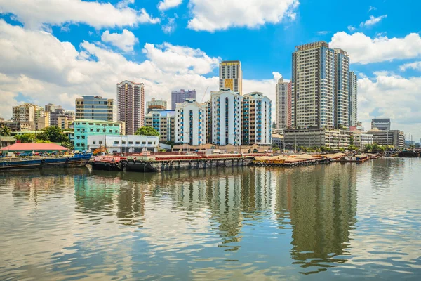 skyline of manila by Pasig River in philippines