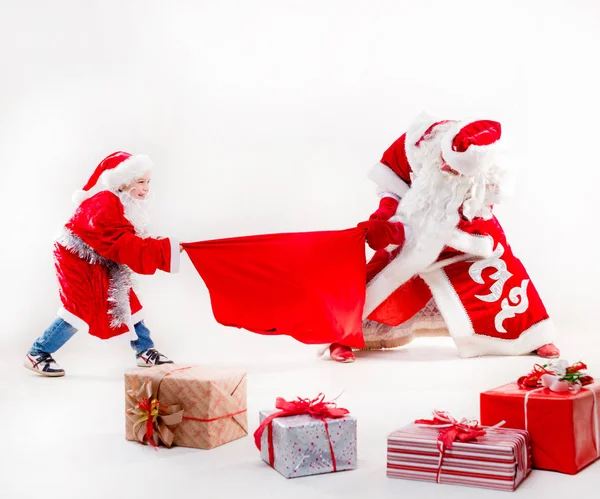 Санта-Клаус с маленьким мальчиком Лицензионные Стоковые Изображения