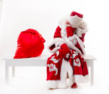 Noel Baba bankta oturan