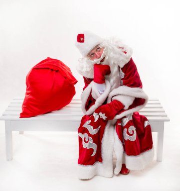 Noel Baba bankta oturan