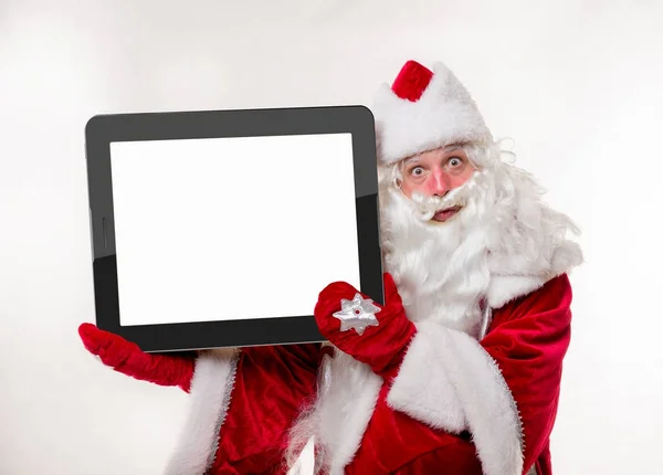 Papai Noel com tablet grande — Fotografia de Stock