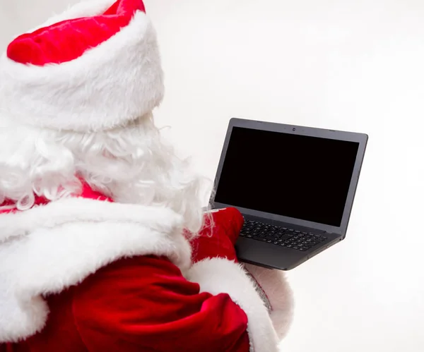 Papai Noel com laptop — Fotografia de Stock
