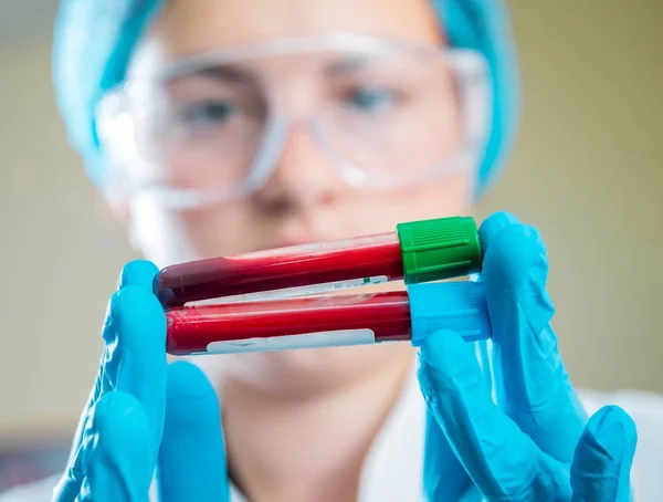 Medic staff at work in the laboratory. Tubes with blood for test.