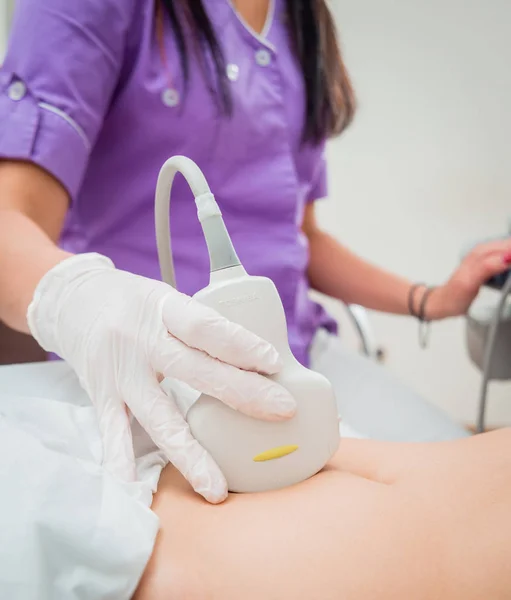 Ultrasound scanner in the hands of a doctor. Diagnostics. Sonography.