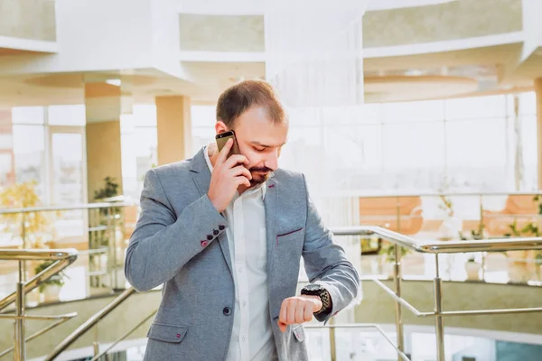 Businessman talking on the phone. Meeting. Office