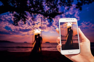 Kaç gün batımında aşık. Plaj. Avuç içi. Fotoğraf ile telefon alınır
