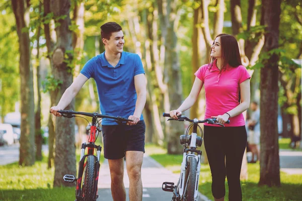 Young Caucasian Couple Cycling Green Bicycle Lane Sunny Day — Stock Photo, Image