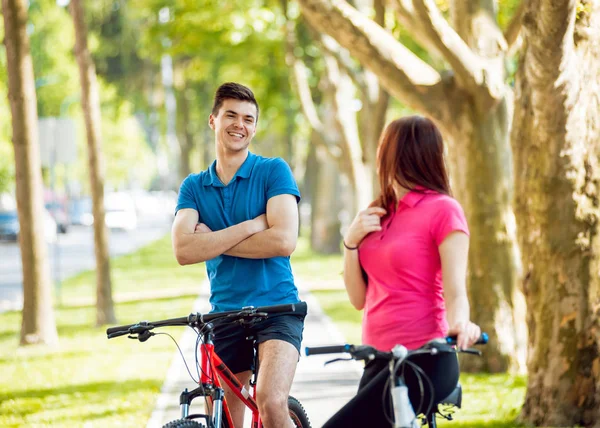 Young Caucasian Couple Cycling Green Bicycle Lane Sunny Day — Stock Photo, Image