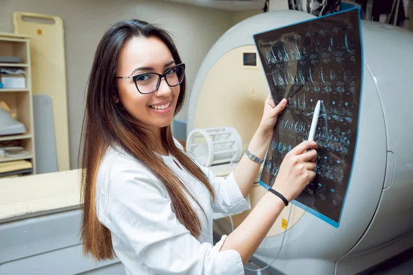 Young middle eastern female doctor in MRI room