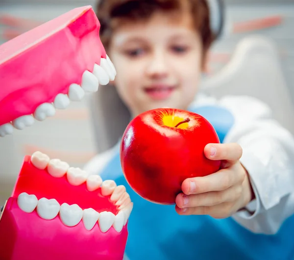 Dentures biting an apple. Funny joke