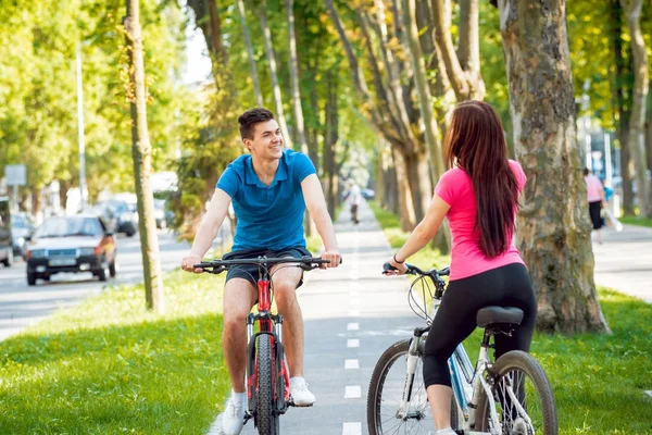 Young Caucasian Couple Cycling Green Bicycle Lane Sunny Day — Stock Photo, Image