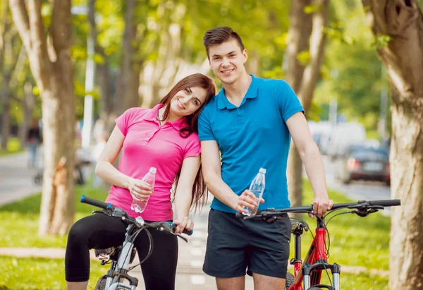 Young Caucasian Couple Cycling Green Bicycle Lane Sunny Day — Stock Photo, Image