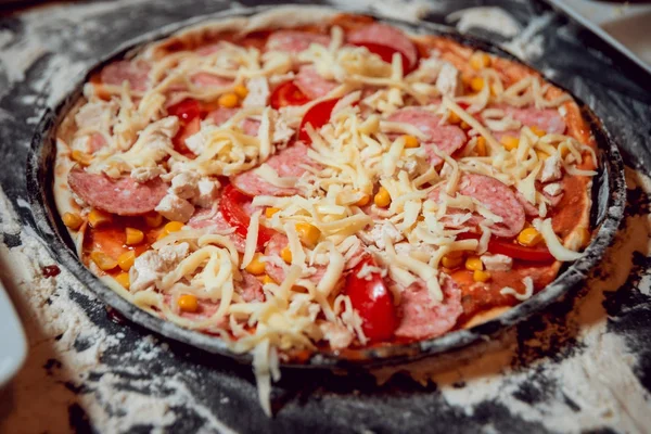 The process of making pizza. Children make pizza at home.