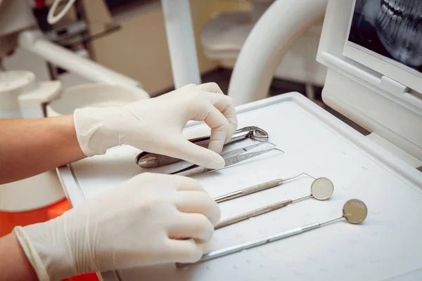 Medical equipment in the hands. Dental office