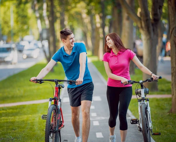 Young Caucasian Couple Cycling Green Bicycle Lane Sunny Day — Stock Photo, Image