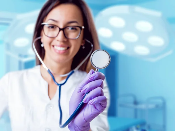 Young female doctor with middle eastern appearance in operating room.