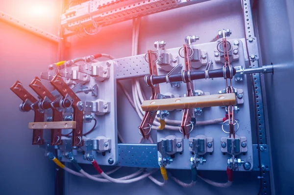 Wires and switches in electric box. Electrical panel with fuses and contactors.