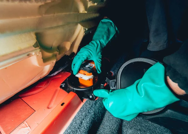 Replacing fuses in the fuse box of the car. Car repair. Service station