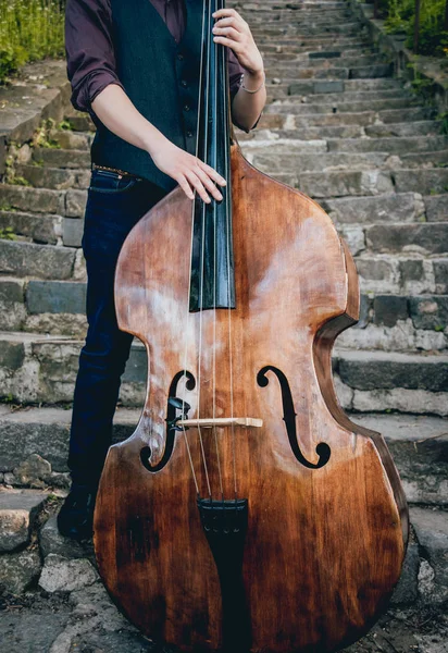 stock image Musician playing contrabass at the street.