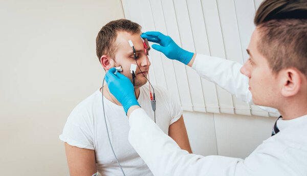 Patient nerves testing using electromyography. Medical examination. EMG