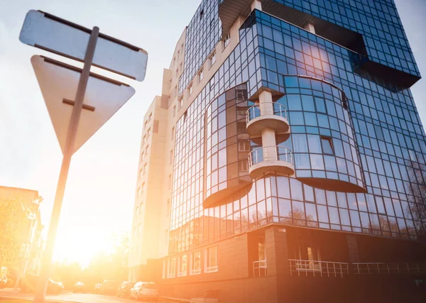 The office building. The sunset in the sky background