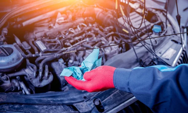 Engine oil change. Car repair. Service station.