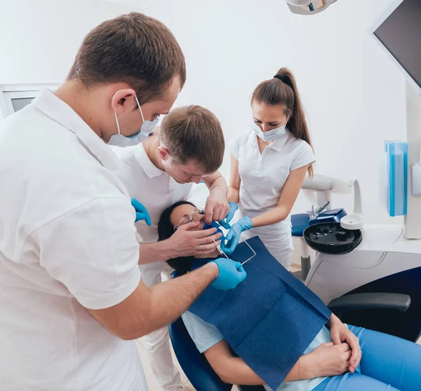 Dentistry cofferdam installation procedure. Dental treatment, modern technology