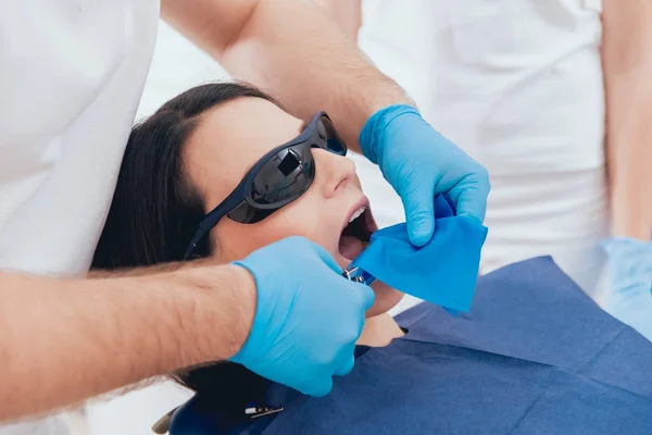 Dentistry cofferdam installation procedure. Dental treatment, modern technology
