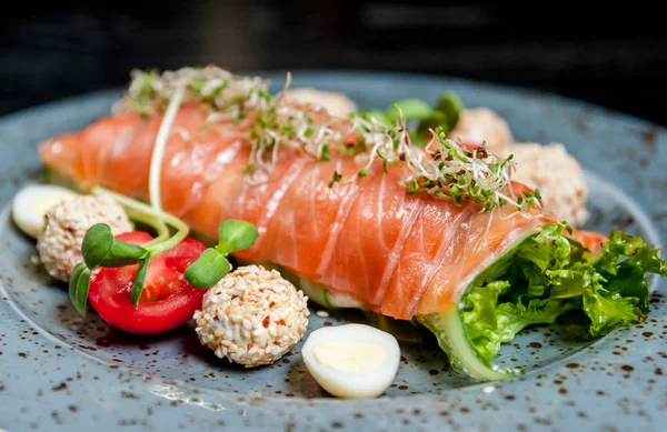 Salmon fish with vegetables on a plate