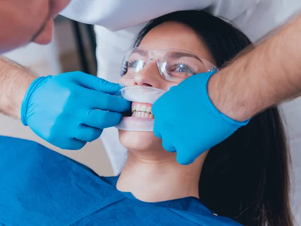 Installation of the expander, preparation for the photo protocol. Dental clinic.