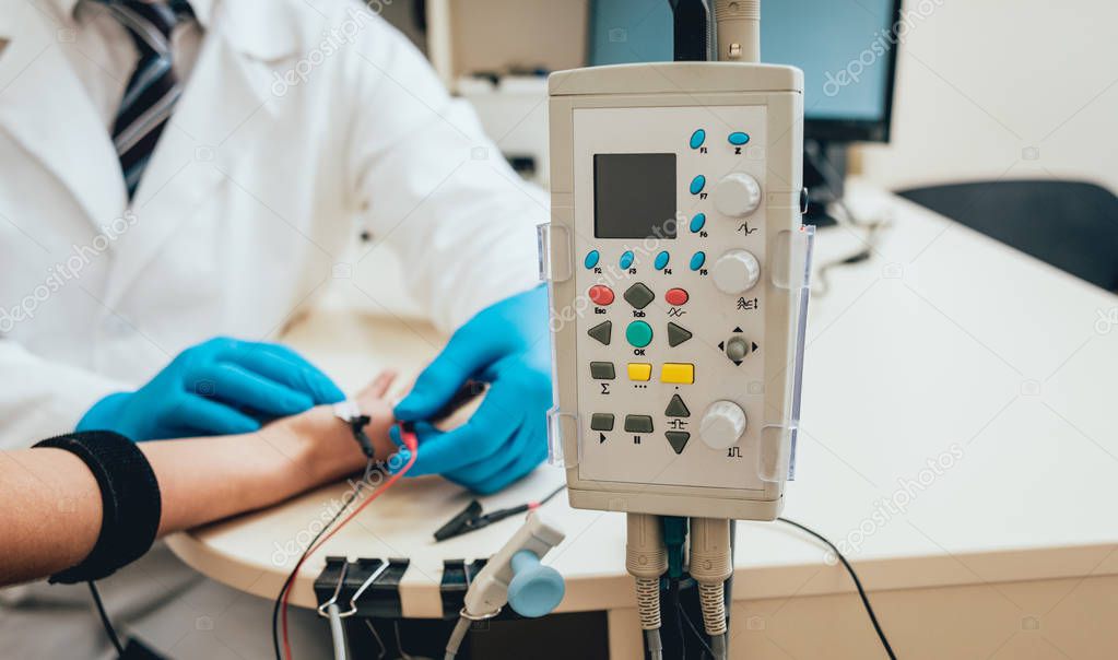 Patient nerves testing using electromyography. Medical examination. EMG