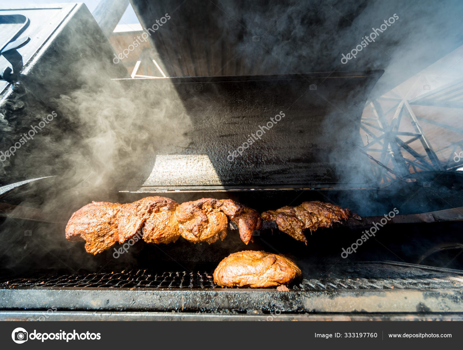 Large barbecue smoker grill at the Meat prepared in barbecue