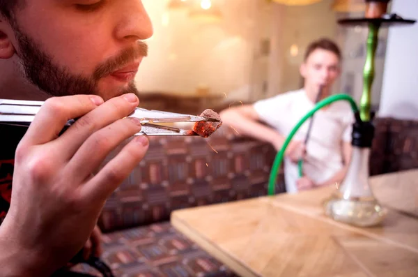 Cooking hookah in the bar. Young man with hookah in restaurant — 스톡 사진