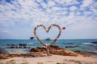 Holiday decoration. Seashells heart. Summer beach concept.