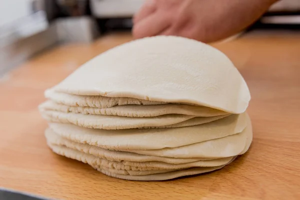 Chef preparing dough for pastry, dumplings, italian pasta or japanese wontons. — ストック写真
