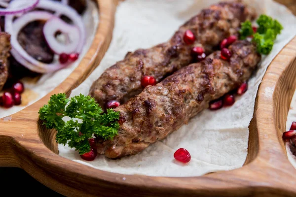 Georgian cuisine food. Grilled meat with khinkali. Georgian restaurant. — ストック写真