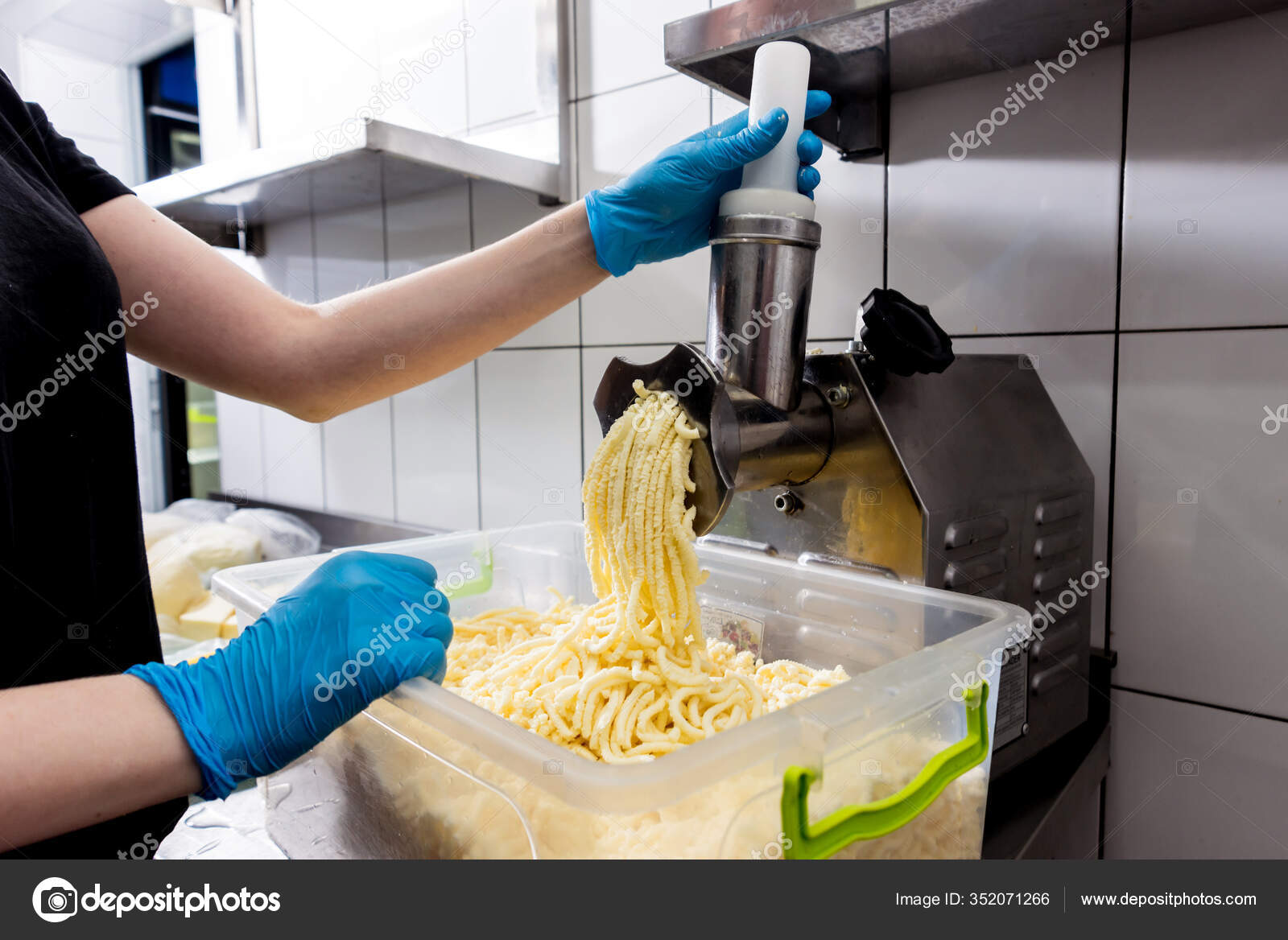 Automatic grater cheese for khachapuri or pizza or pasta. Cooking Stock  Photo by ©Romaset 352071266