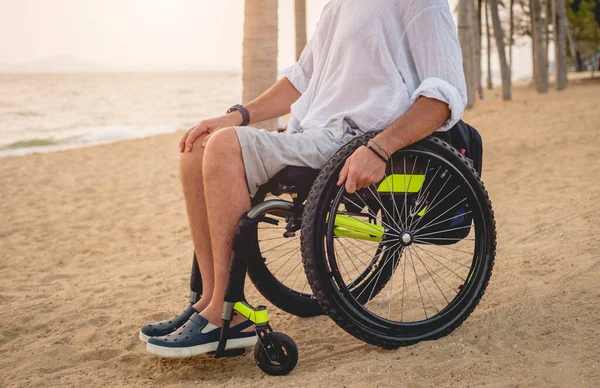 Disabled man in a wheelchair on the beach. — 스톡 사진