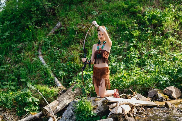 Young beautiful amazon girl hunting in the forest — Stock Photo, Image