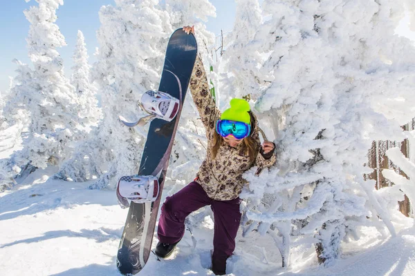 Portrait of young smiling woman with snowboard — Stock Photo, Image