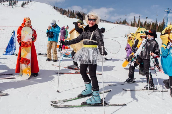 Woman on ski in carnival costume of dragonfly. — Stock Photo, Image