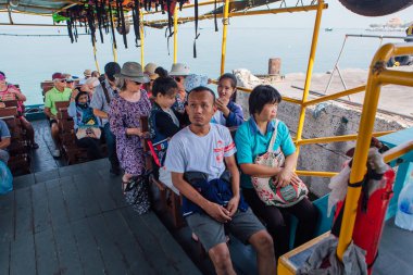 Sriracha, Chonburi, Thailand - February 15, 2018: Tourists traveling on a ferry to the Koh Sichang island.