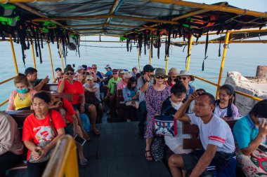 Sriracha, Chonburi, Thailand - February 15, 2018: Tourists traveling on a ferry to the Koh Sichang island.